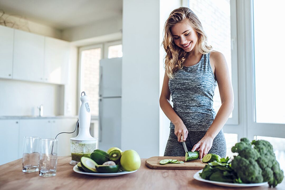 The girl prepares a healthy diet after calculating her daily calorie intake